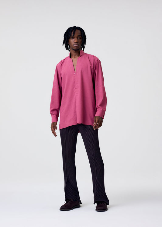 A model wears the HOMME PLISSÉ ISSEY MIYAKE PL RAMIE SHIRT shirt.