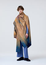 A model wears the HOMME PLISSÉ ISSEY MIYAKE PAINT BRUSH CLOSE UP coat.