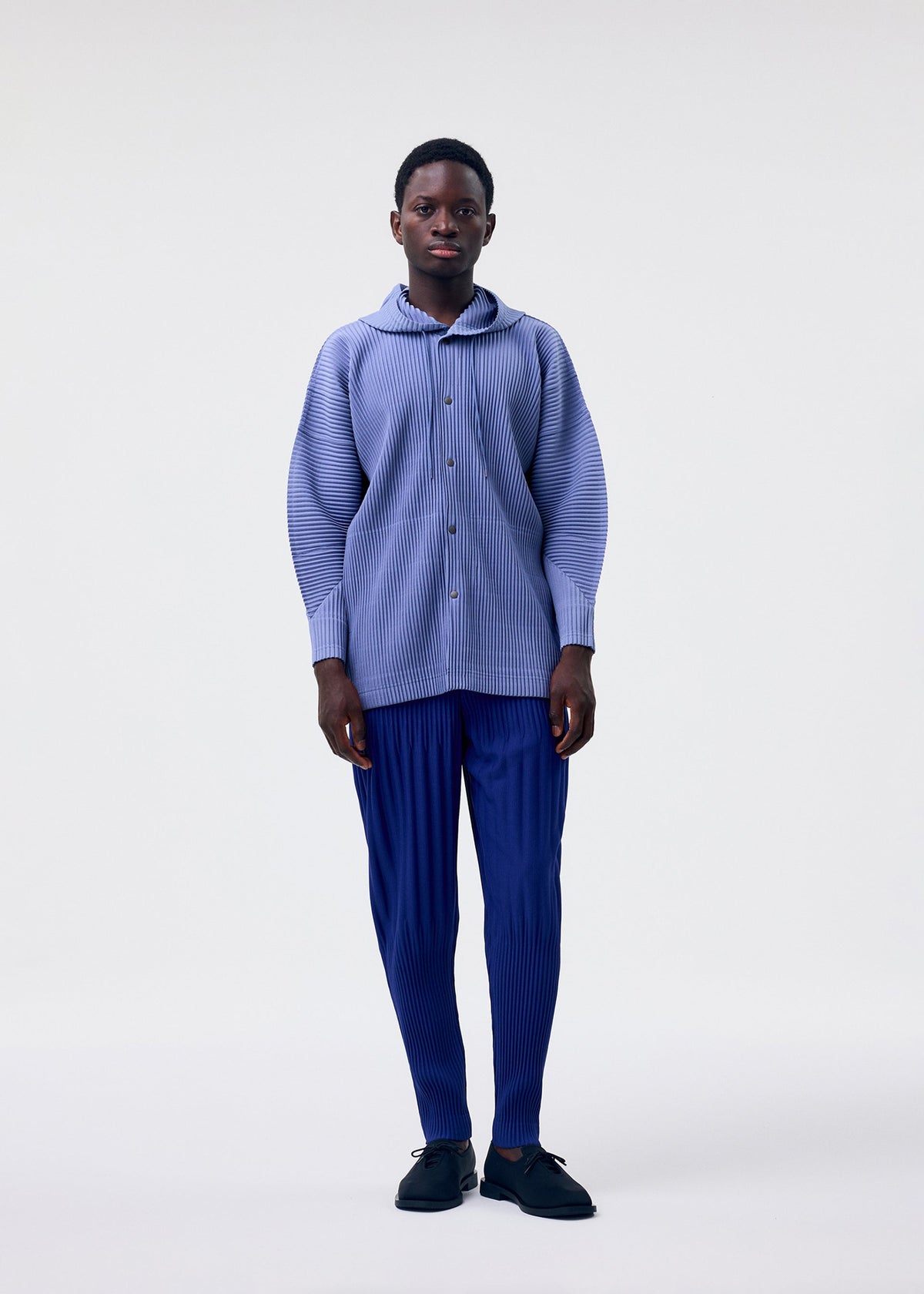A model wears the HOMME PLISSÉ ISSEY MIYAKE MONTHLY COLORS FEBRUARY jacket.