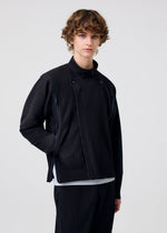 A model wears the HOMME PLISSÉ ISSEY MIYAKE MULTI-FASTENED multi-fastened-jacket-lucca-storico-blue.