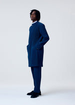 A model wears the HOMME PLISSÉ ISSEY MIYAKE TAILORED PLEATS 1 jacket.
