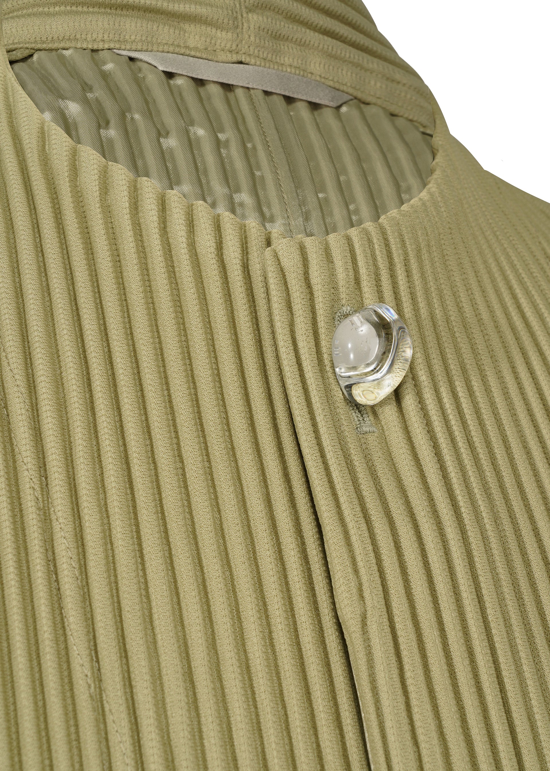 A detail shot of the HOMME PLISSÉ ISSEY MIYAKE TAILORED PLEATS 1 jacket.