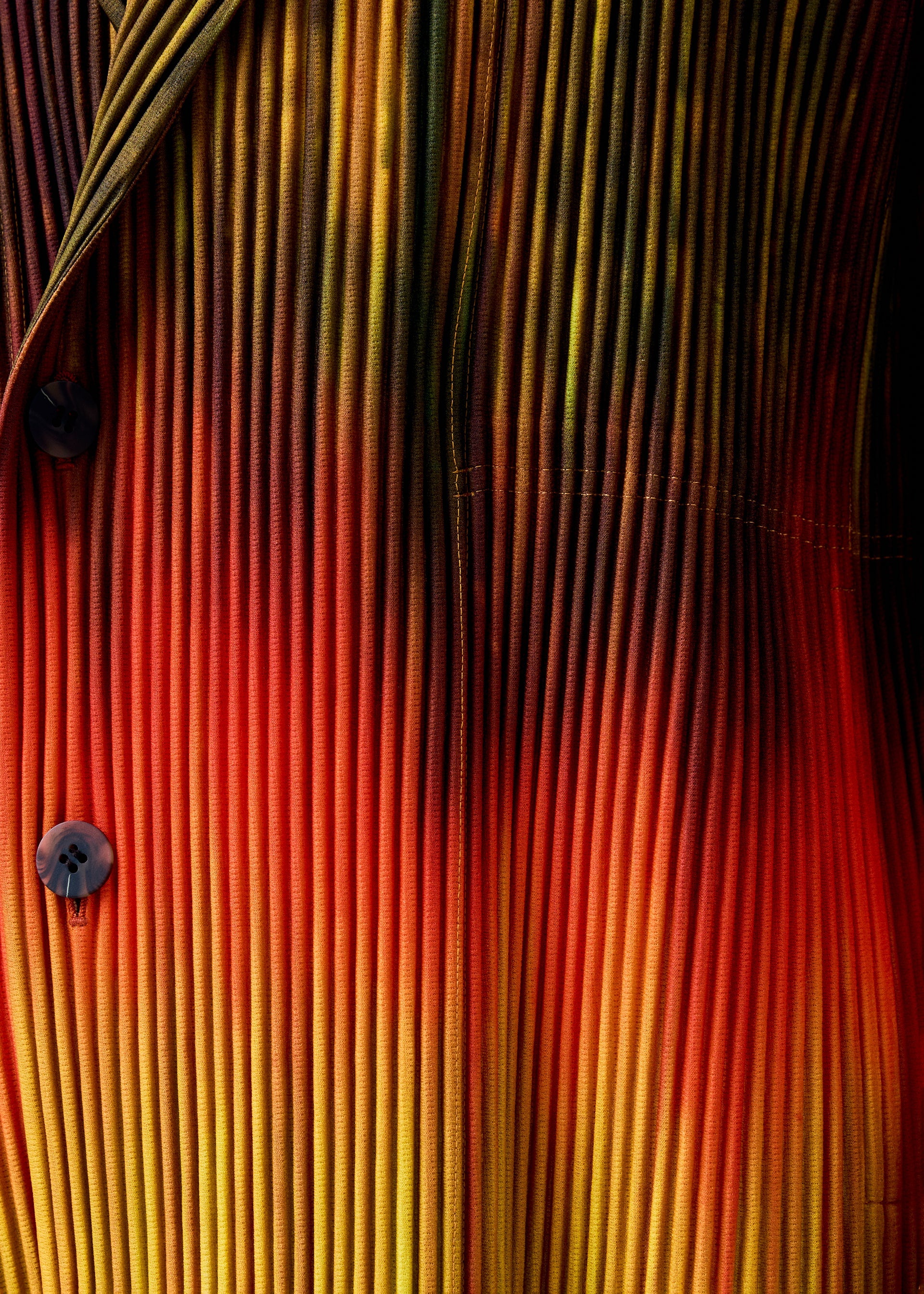 A model wears the HOMME PLISSÉ ISSEY MIYAKE PAINT BRUSH CLOSE UP jacket.