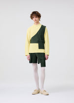 A model wears the HOMME PLISSÉ ISSEY MIYAKE PAINTER'S GEAR vest.