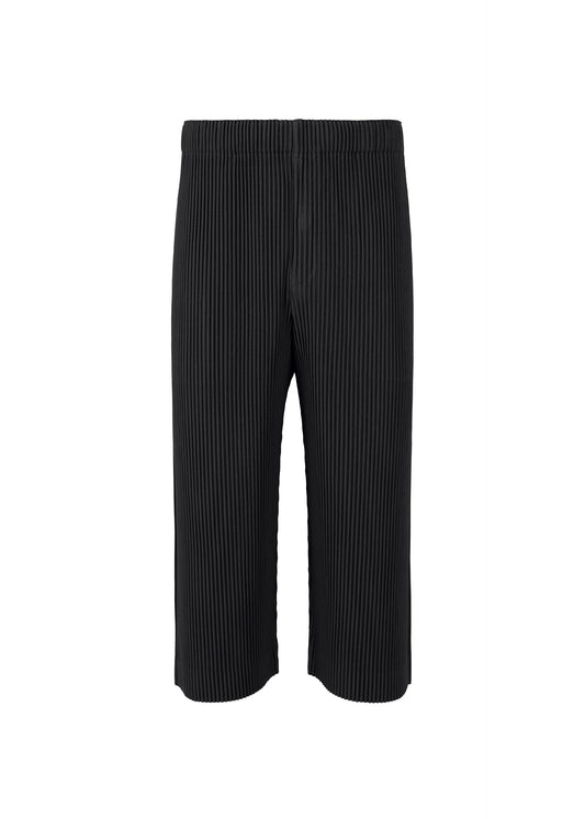 A product shot of the HOMME PLISSÉ ISSEY MIYAKE MONTHLY COLORS MAY trousers in black (15).