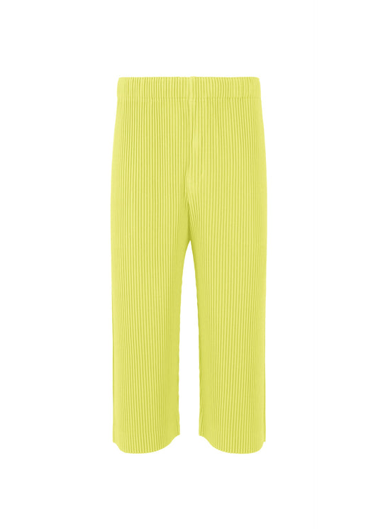 A product shot of the HOMME PLISSÉ ISSEY MIYAKE MONTHLY COLORS MAY trousers in zucchini yellow (53).