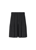 A product shot of the HOMME PLISSÉ ISSEY MIYAKE MONTHLY COLORS : JUNE trousers in black.