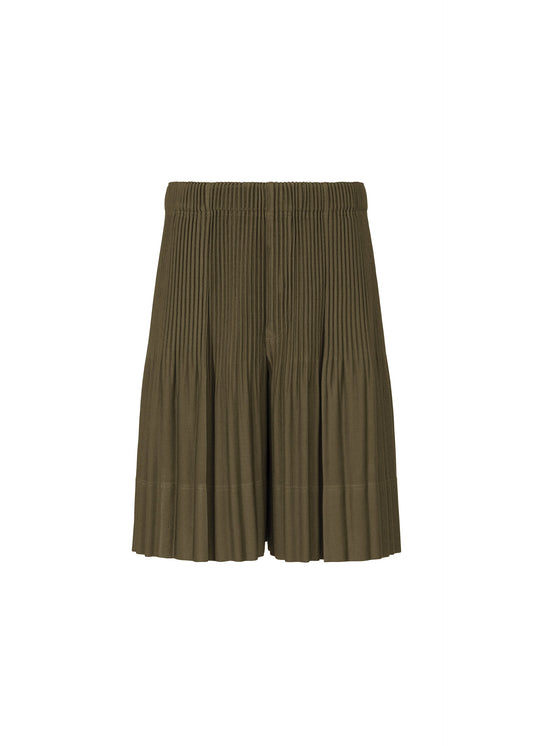 A product shot of the HOMME PLISSÉ ISSEY MIYAKE MONTHLY COLORS : JUNE trousers in genova metal ocher.