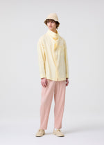 A model wears the HOMME PLISSÉ ISSEY MIYAKE COLOR PLEATS 2 trousers.