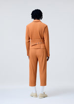 A model wears the HOMME PLISSÉ ISSEY MIYAKE TAILORED PLEATS 2 trousers.
