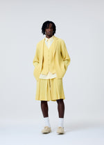 A model wears the HOMME PLISSÉ ISSEY MIYAKE TAILORED PLEATS 2 trousers.