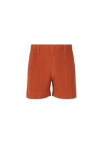 A product shot of the HOMME PLISSÉ ISSEY MIYAKE TAILORED PLEATS 3 trousers in jambon pink.