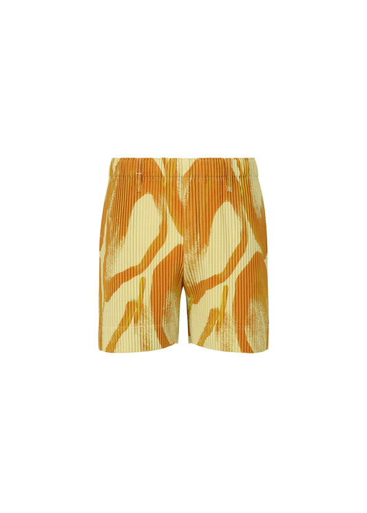 A product shot of the HOMME PLISSÉ ISSEY MIYAKE FRUITS & VEGETABLES shorts in yellow (52).