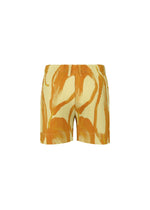 A detail shot of the HOMME PLISSÉ ISSEY MIYAKE FRUITS & VEGETABLES shorts.