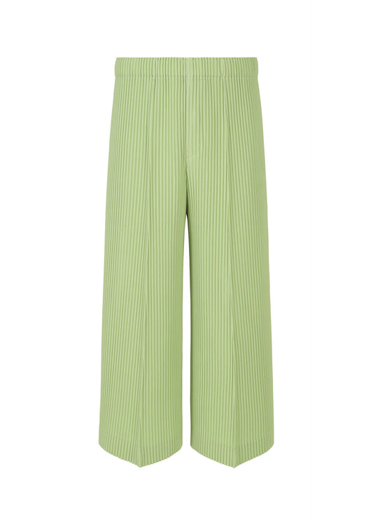A product shot of the HOMME PLISSÉ ISSEY MIYAKE PLEATS BOTTOMS 2 trousers in pizza gregorio green (63).