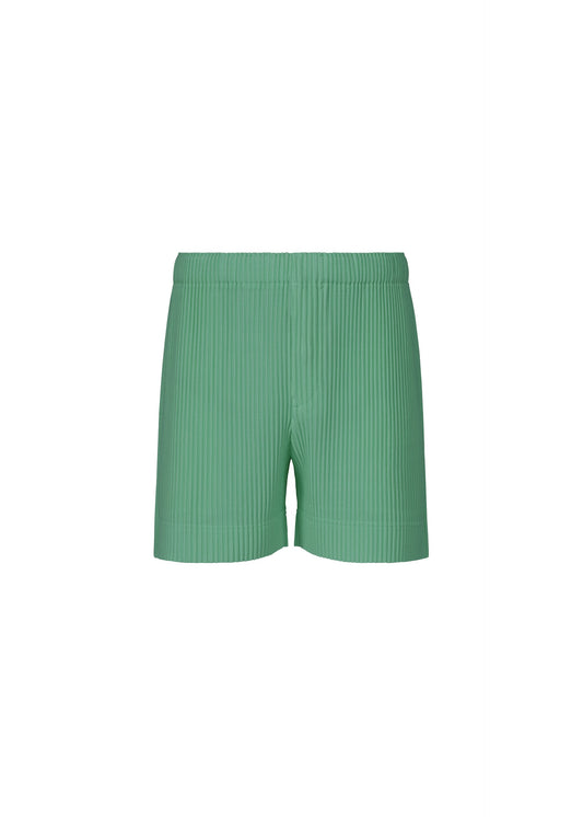 A product shot of the HOMME PLISSÉ ISSEY MIYAKE COLORFUL PLEATS BOTTOMS trousers in storico post green.