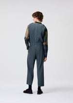 A model wears the HOMME PLISSÉ ISSEY MIYAKE PLEATS BOTTOMS 2 jumpsuit.