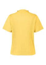 A detail shot of the HOMME PLISSÉ ISSEY MIYAKE MONTHLY COLORS MARCH top.