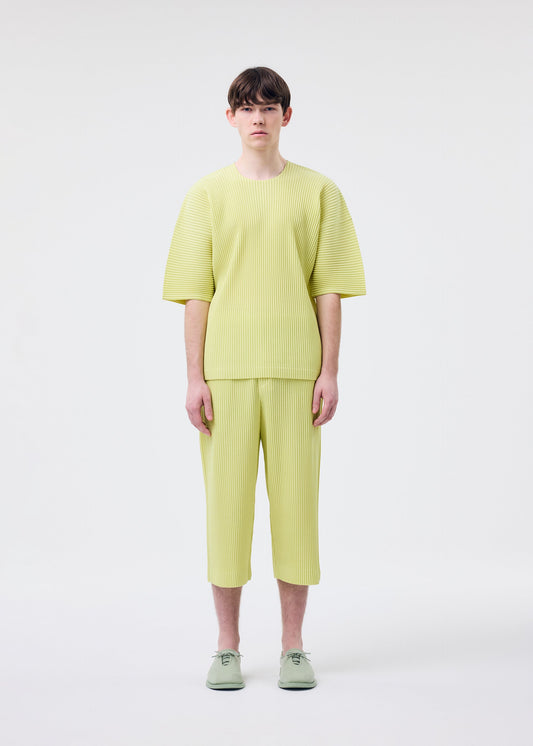 A model wears the HOMME PLISSÉ ISSEY MIYAKE MONTHLY COLORS MAY top.