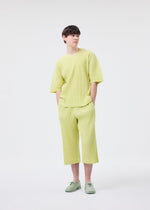 A model wears the HOMME PLISSÉ ISSEY MIYAKE MONTHLY COLORS MAY top.