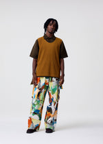 A model wears the HOMME PLISSÉ ISSEY MIYAKE MONTHLY COLORS : JUNE monthly-colors-june-top-venice-boat-brown.
