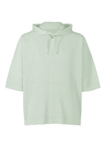 A product shot of the HOMME PLISSÉ ISSEY MIYAKE MONTHLY COLORS : JUNE top in boboli moss ash.
