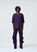 A model wears the HOMME PLISSÉ ISSEY MIYAKE RELEASE T 1 clothing.