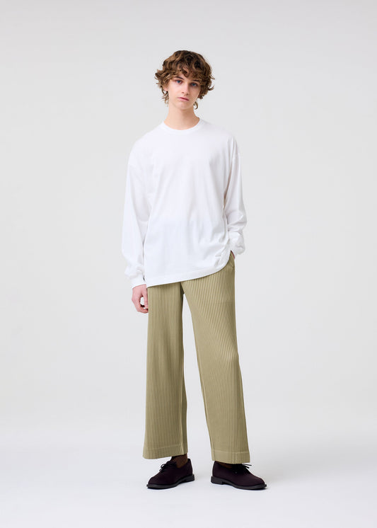 A model wears the HOMME PLISSÉ ISSEY MIYAKE COLOR CHIPS T SHIRT top.