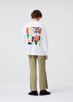 A model wears the HOMME PLISSÉ ISSEY MIYAKE COLOR CHIPS T SHIRT top.