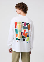 A model wears the HOMME PLISSÉ ISSEY MIYAKE COLOR CHIPS T SHIRT top.