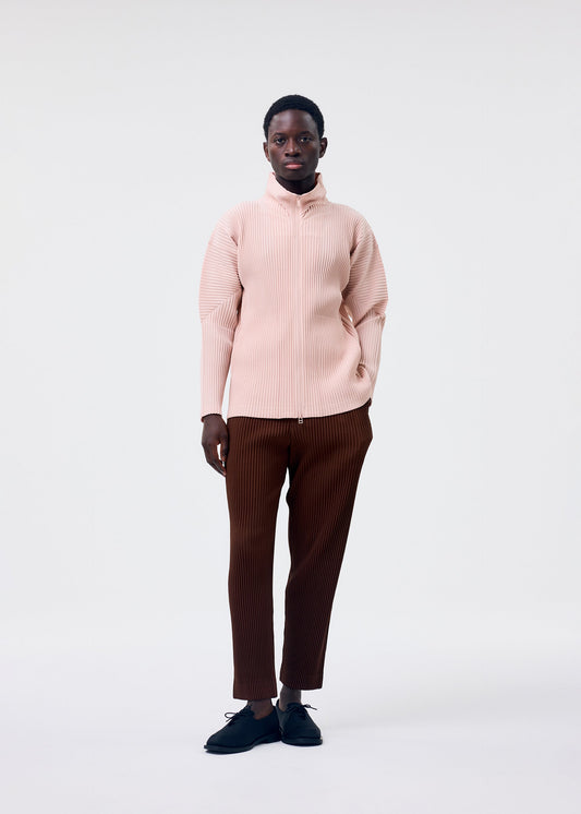 A model wears the HOMME PLISSÉ ISSEY MIYAKE COLOR PLEATS 2 jacket.