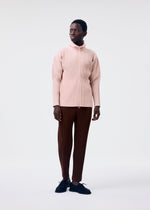 A model wears the HOMME PLISSÉ ISSEY MIYAKE COLOR PLEATS 2 jacket.