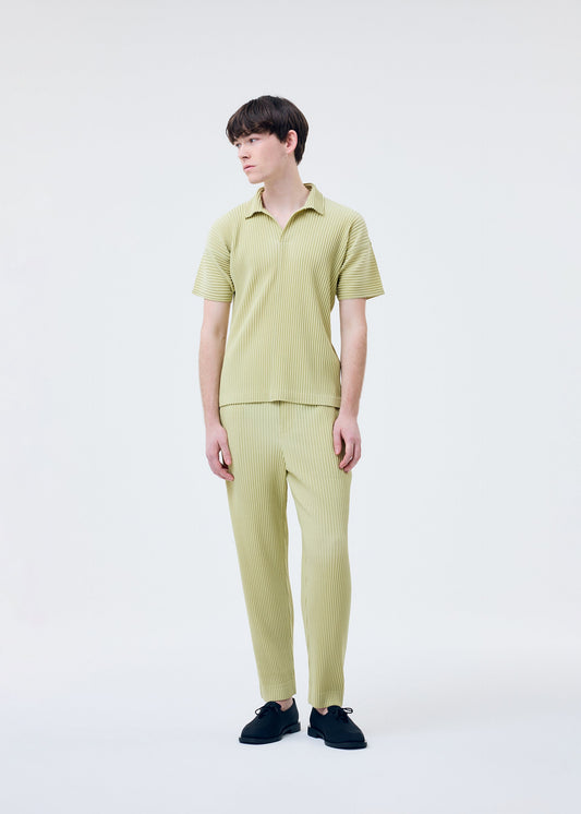 A model wears the HOMME PLISSÉ ISSEY MIYAKE COLOR PLEATS 2 shirt.