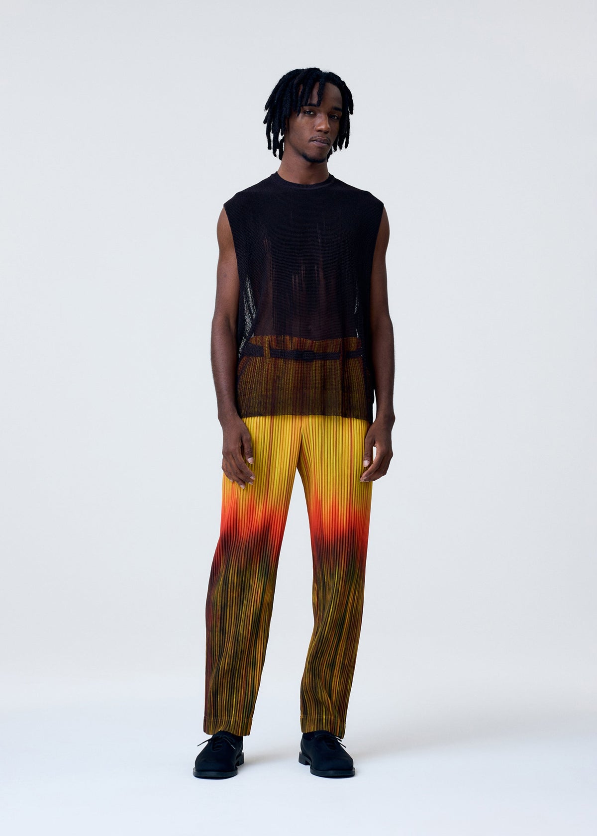 A model wears the HOMME PLISSÉ ISSEY MIYAKE BRUSH CLOSE UP KNIT vest.