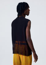 A model wears the HOMME PLISSÉ ISSEY MIYAKE BRUSH CLOSE UP KNIT vest.