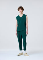 A model wears the HOMME PLISSÉ ISSEY MIYAKE BASIC KNIT clothing.