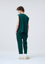 A model wears the HOMME PLISSÉ ISSEY MIYAKE BASIC KNIT clothing.