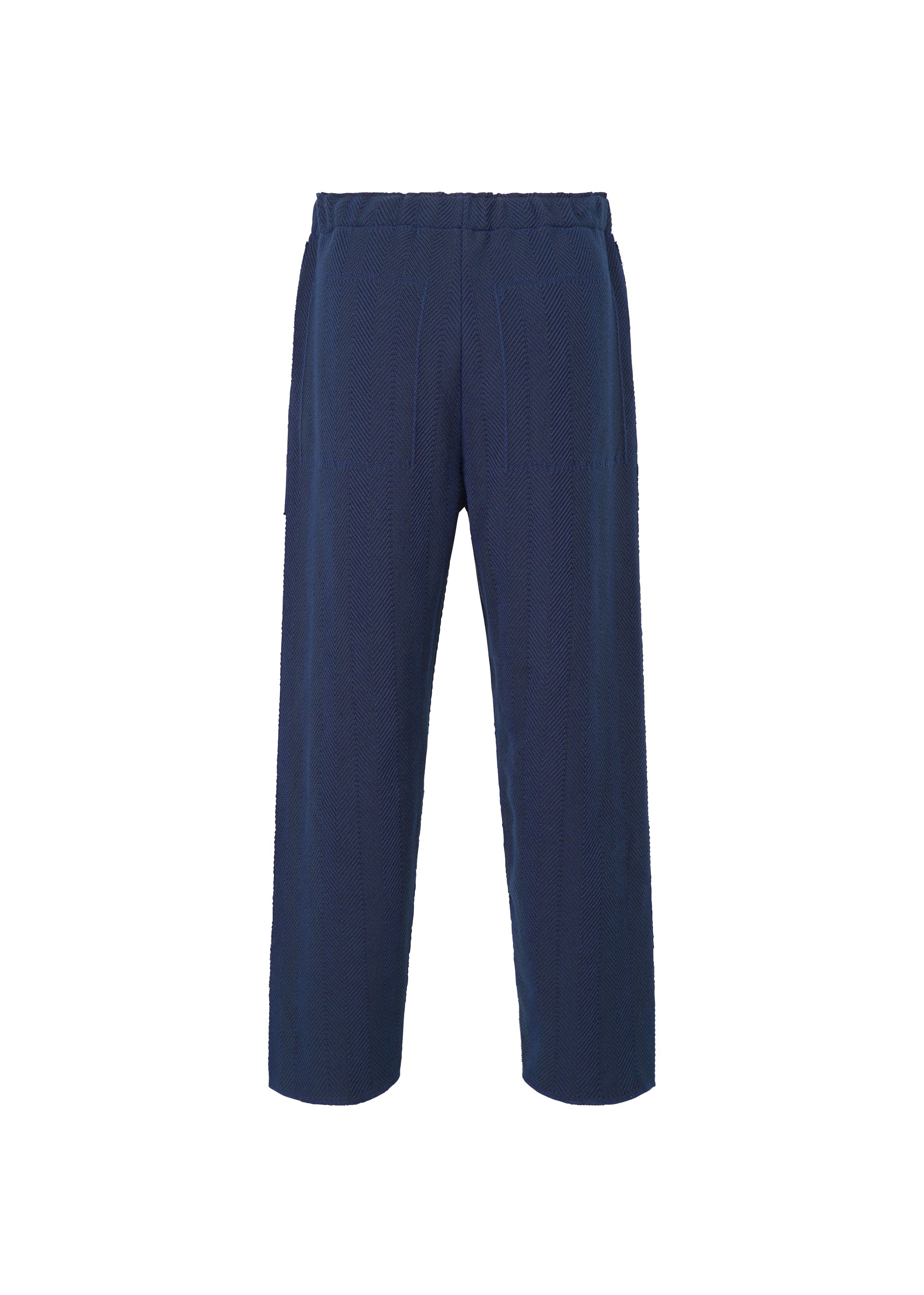 A detail shot of the HOMME PLISSÉ ISSEY MIYAKE INLAID KNIT trousers.