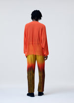 A model wears the HOMME PLISSÉ ISSEY MIYAKE BRUSH CLOSE UP KNIT top.