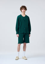 A model wears the HOMME PLISSÉ ISSEY MIYAKE BASIC KNIT clothing.