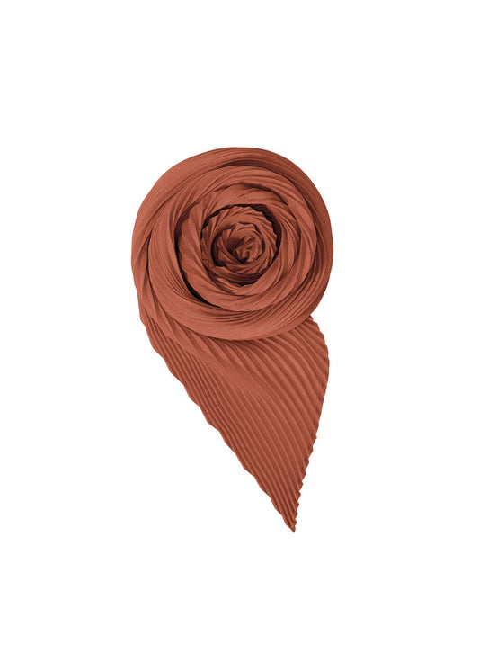A product shot of the HOMME PLISSÉ ISSEY MIYAKE PLEATS STOLE stole in vermillion.