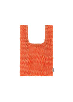 A product shot of the HOMME PLISSÉ ISSEY MIYAKE MESH PLEATS BAG tote in orange.