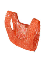 A detail shot of the HOMME PLISSÉ ISSEY MIYAKE MESH PLEATS BAG tote.