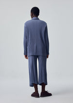 A model wears the HOMME PLISSÉ ISSEY MIYAKE KERSEY PLEATS kersey-pleats-cropped-trousers-purple.