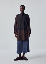 A model wears the HOMME PLISSÉ ISSEY MIYAKE KERSEY PLEATS kersey-pleats-cropped-trousers-purple.