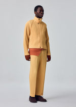 A model wears the HOMME PLISSÉ ISSEY MIYAKE TAILORED PLEATS 1 tailored-pleats-1-raglan-jacket-shadow-brown.