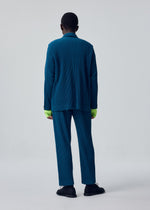 A model wears the HOMME PLISSÉ ISSEY MIYAKE TAILORED PLEATS 1 tailored-pleats-1-jacket-shadow-blue.