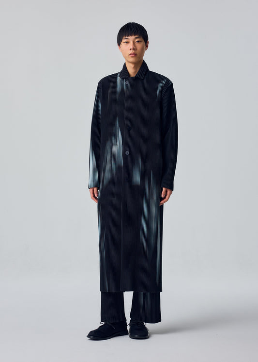 A model wears the HOMME PLISSÉ ISSEY MIYAKE IN THE SHADOW in-the-shadow-long-jacket-shadow-black.