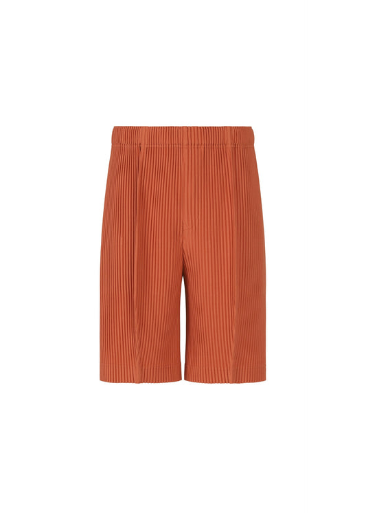 A product shot of the HOMME PLISSÉ ISSEY MIYAKE MONTHLY COLORS : AUGUST shorts in shade vermillion.