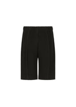 A detail shot of the HOMME PLISSÉ ISSEY MIYAKE MONTHLY COLORS : AUGUST shorts.